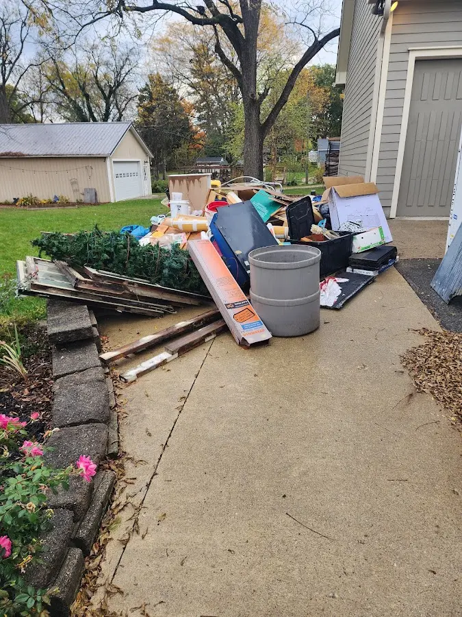 Dumpster being loaded with debris for 3 Yard Dumpster Rental in Stone Park